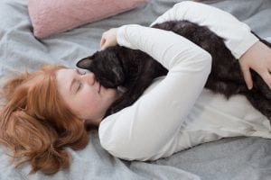cats enjoy sleeping on their owner's body